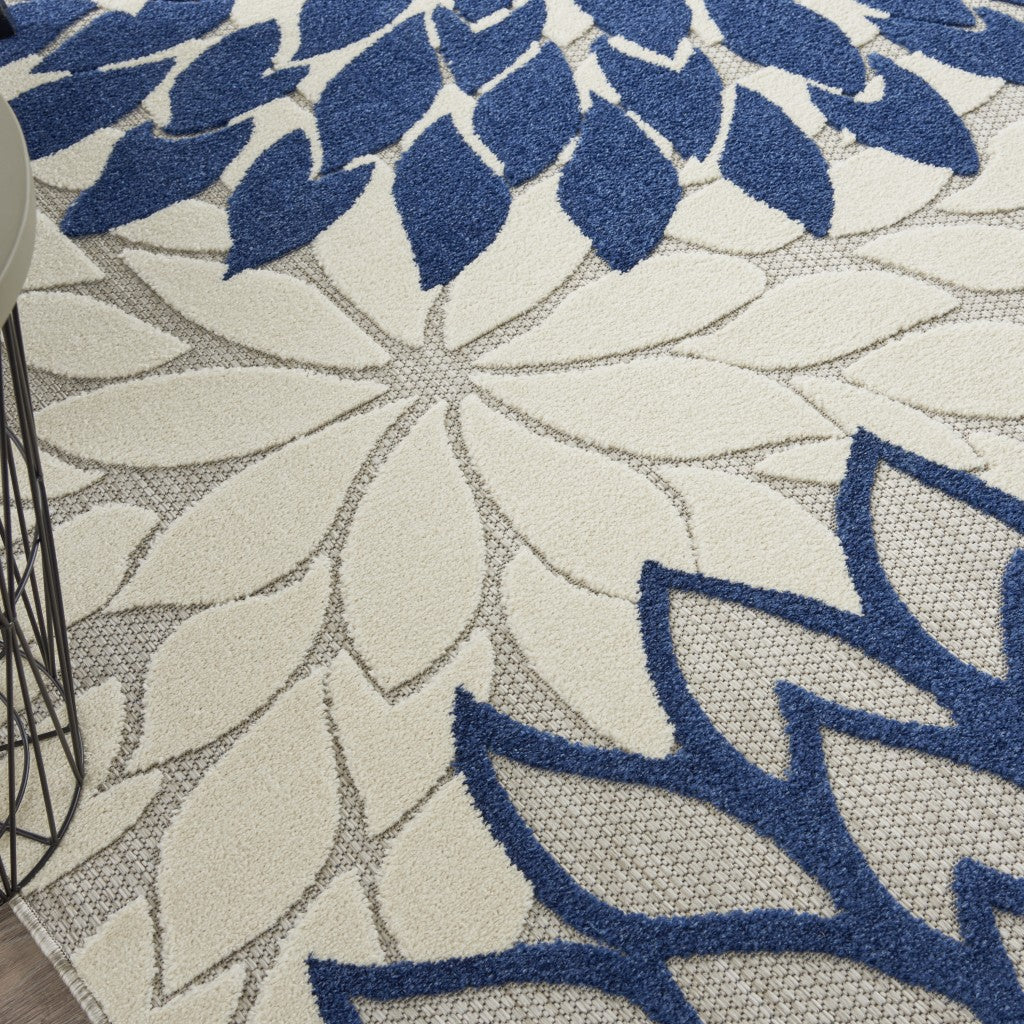 8' X 11' Ivory And Blue Floral Indoor Outdoor Area Rug