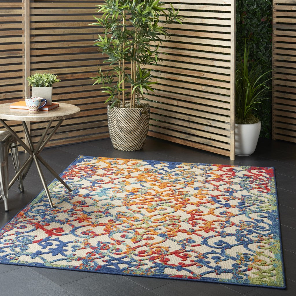 6' X 9' Ivory And Blue Floral Indoor Outdoor Area Rug