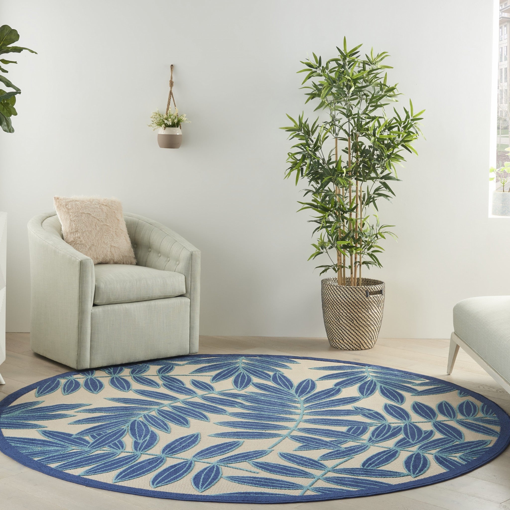 8' Round Blue And Ivory Round Floral Stain Resistant Indoor Outdoor Area Rug