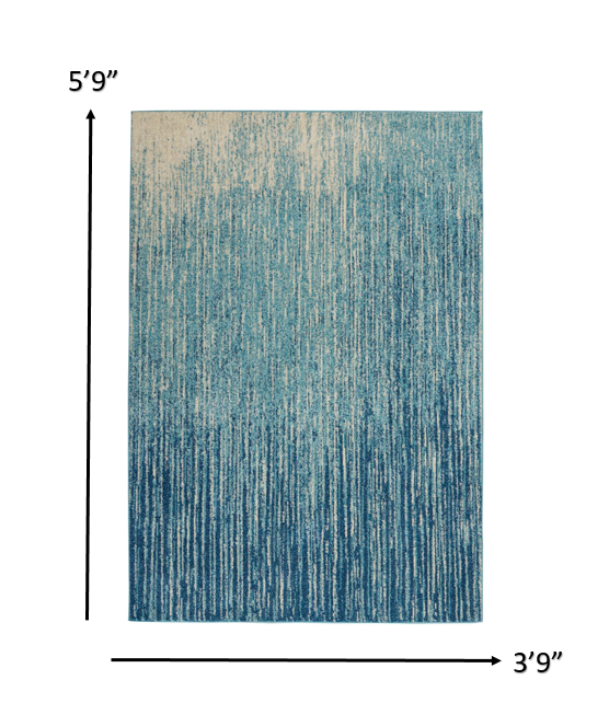 4' X 6' Ivory And Blue Abstract Power Loom Area Rug