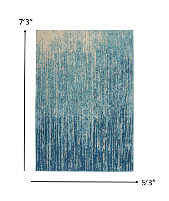 5' X 7' Ivory And Blue Abstract Power Loom Area Rug