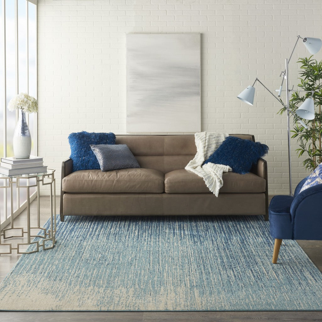 7' X 10' Ivory And Blue Abstract Power Loom Area Rug