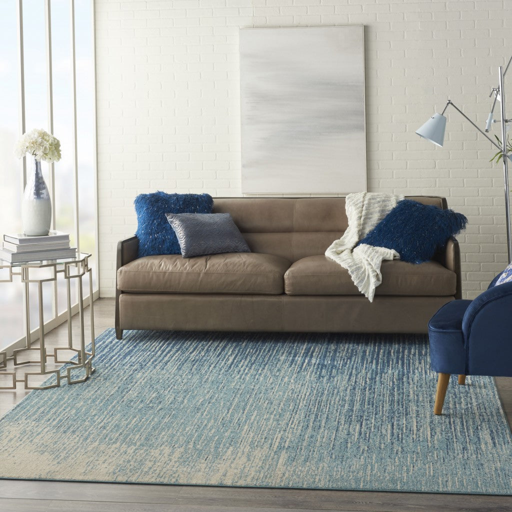 7' X 10' Ivory And Blue Abstract Power Loom Area Rug