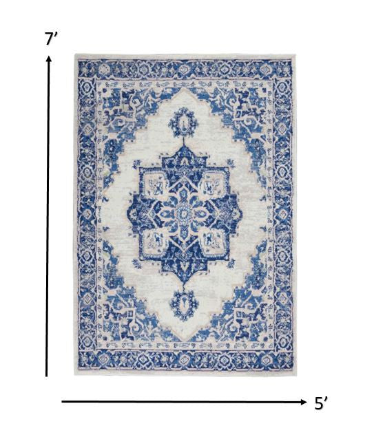 5' X 7' Blue And Ivory Floral Dhurrie Area Rug