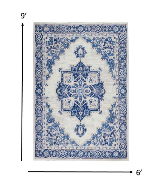 6' X 9' Blue And Ivory Floral Dhurrie Area Rug