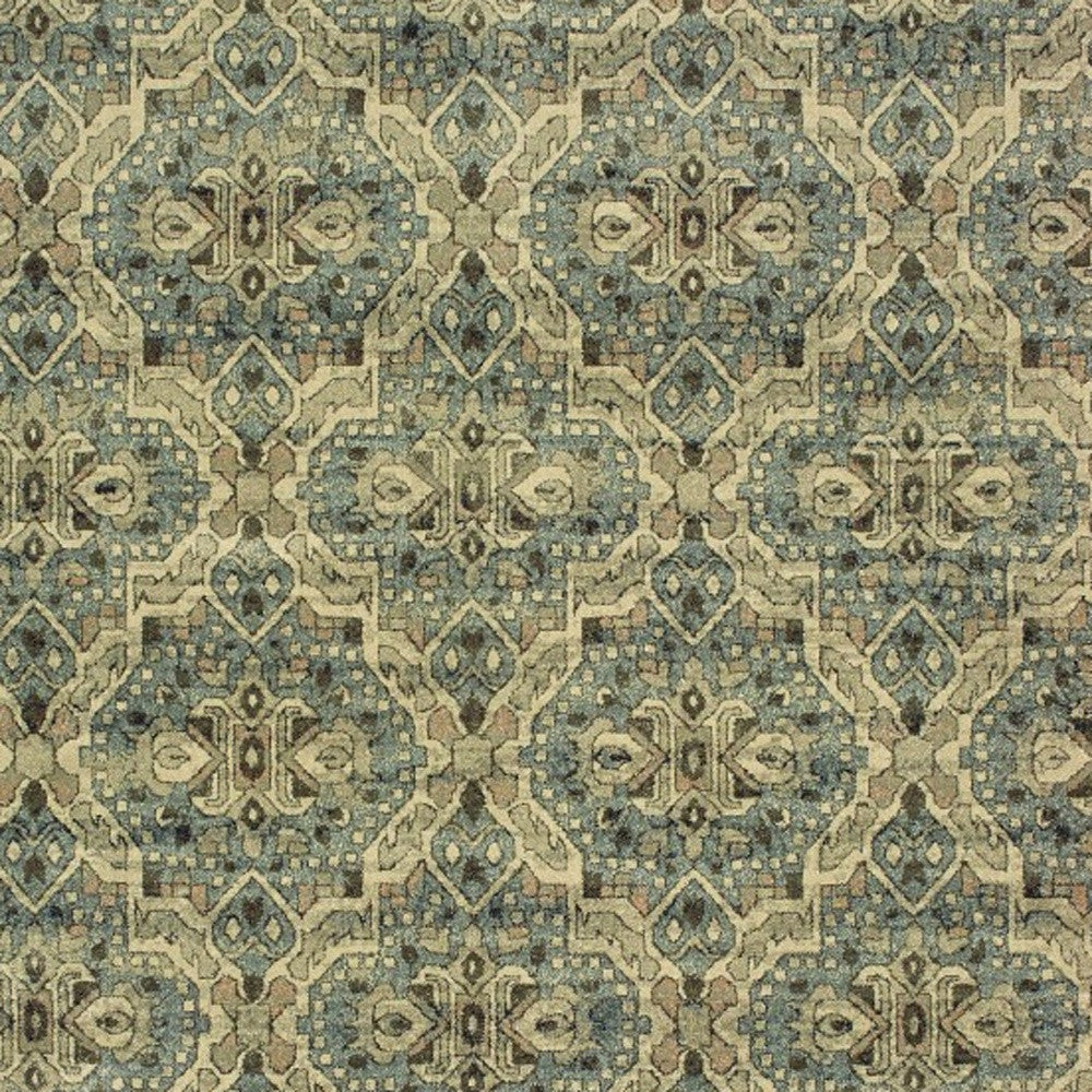 5’X8’ Ivory And Blue Geometric Area Rug