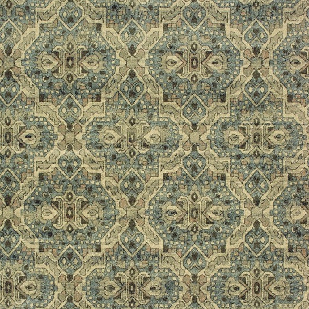 7’X10’ Ivory And Blue Geometric Area Rug