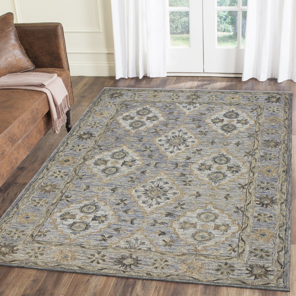 5’ x 8’ Blue and Tan Traditional Area Rug