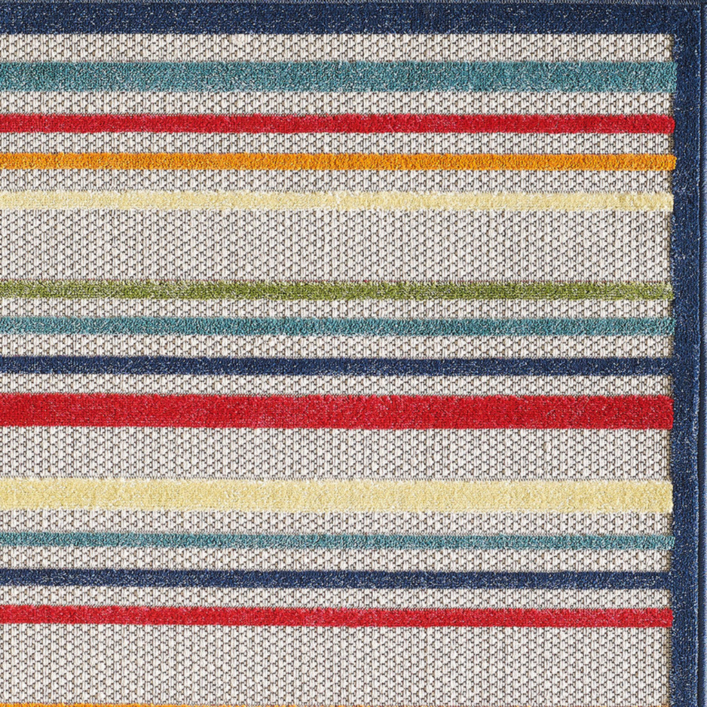 5' X 7' Ivory And Blue Striped Stain Resistant Indoor Outdoor Area Rug