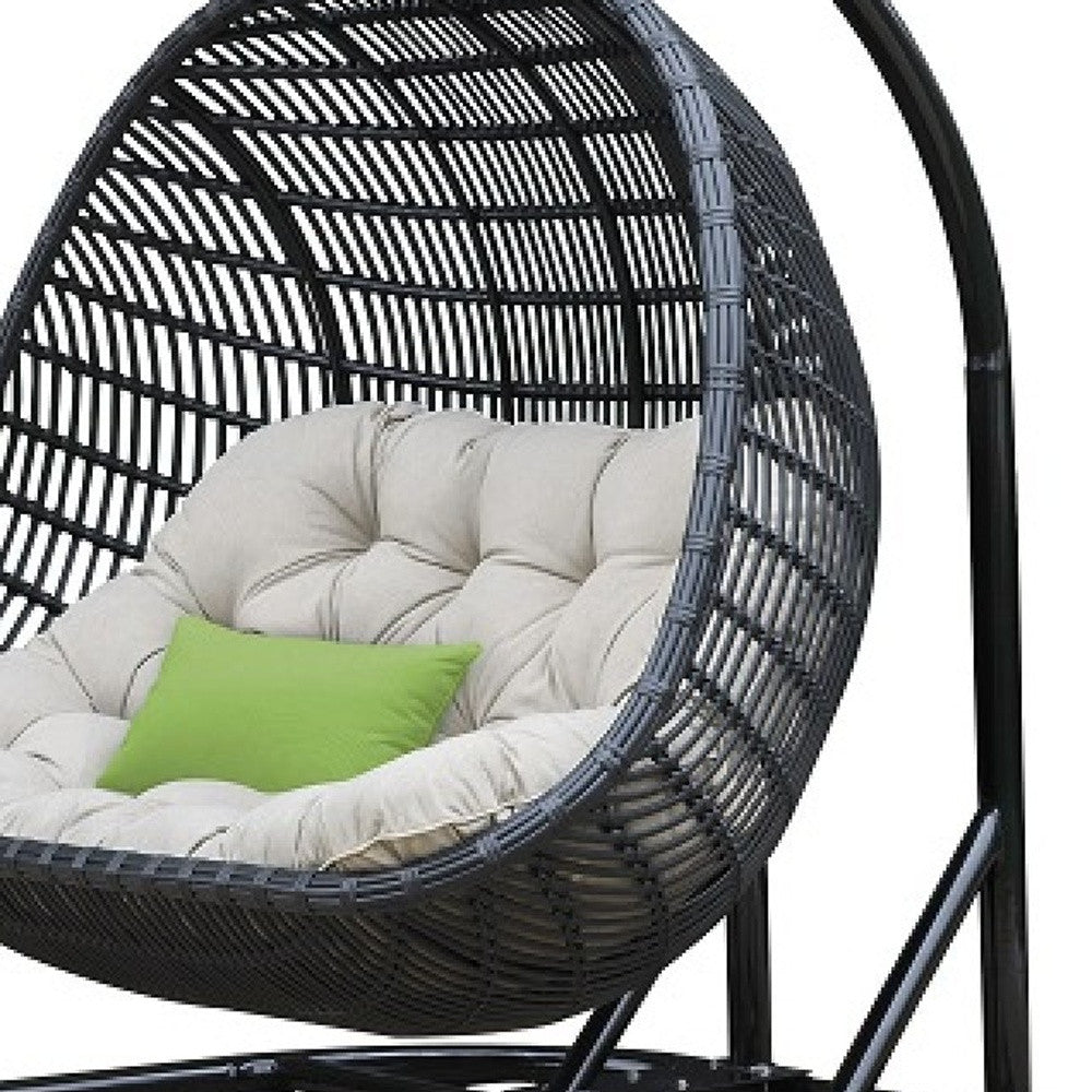 69" Beige And Black Metal Swing Chair With Beige Cushion