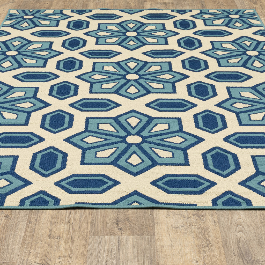 2' X 4' Ivory and Blue Geometric Stain Resistant Indoor Outdoor Area Rug