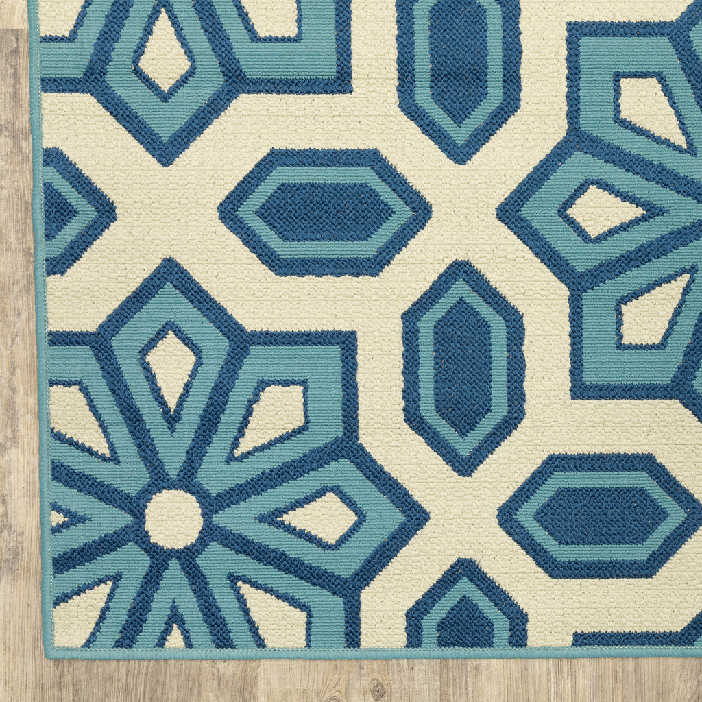 2' X 8' Ivory and Blue Geometric Stain Resistant Indoor Outdoor Area Rug