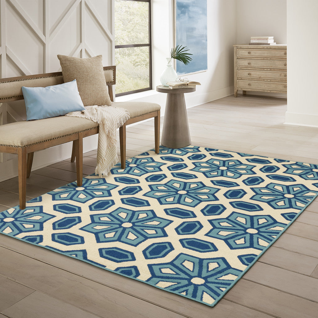 5' x 8' Ivory and Blue Geometric Stain Resistant Indoor Outdoor Area Rug