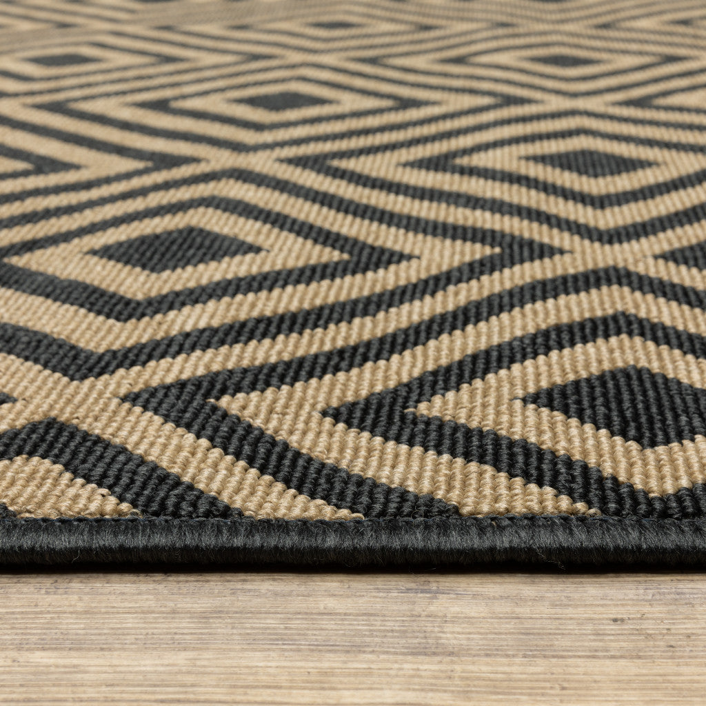 2' X 4' Black and Tan Geometric Stain Resistant Indoor Outdoor Area Rug