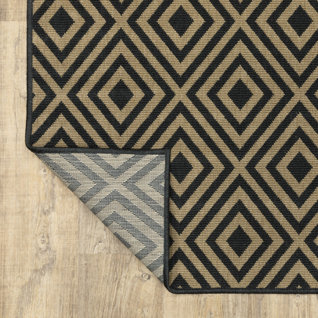 2' X 8' Black and Tan Geometric Stain Resistant Indoor Outdoor Area Rug