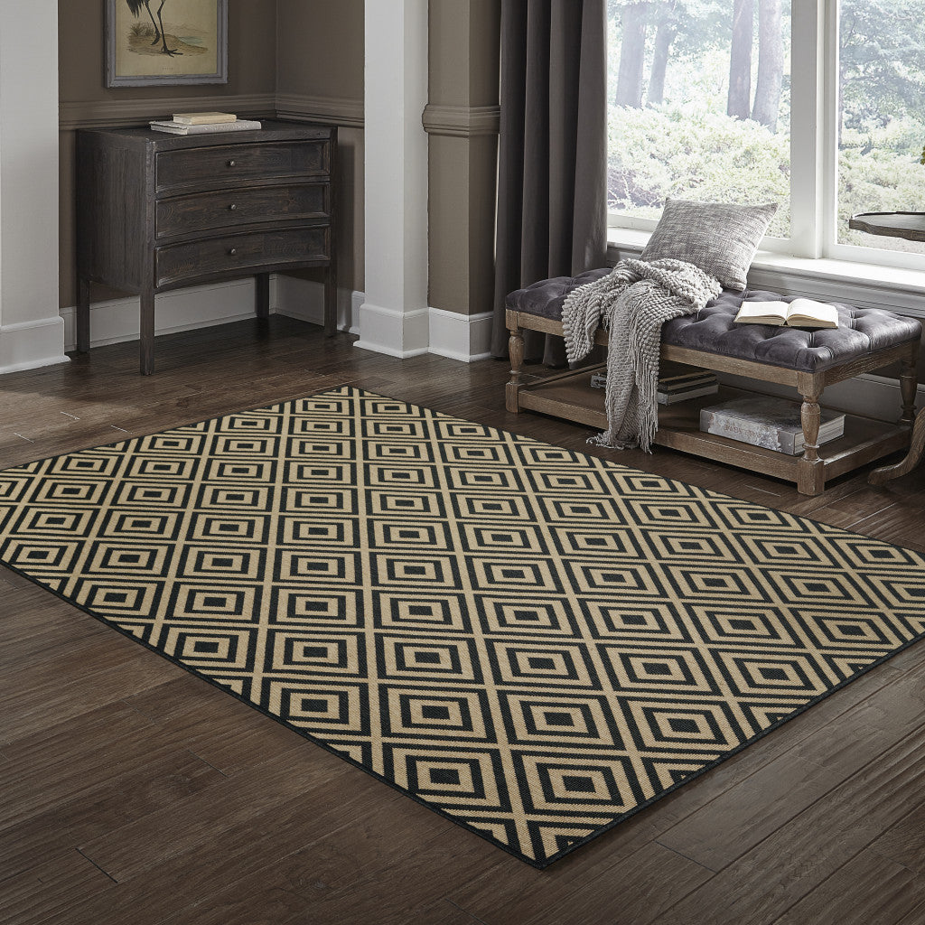 5' x 8' Black and Tan Geometric Stain Resistant Indoor Outdoor Area Rug