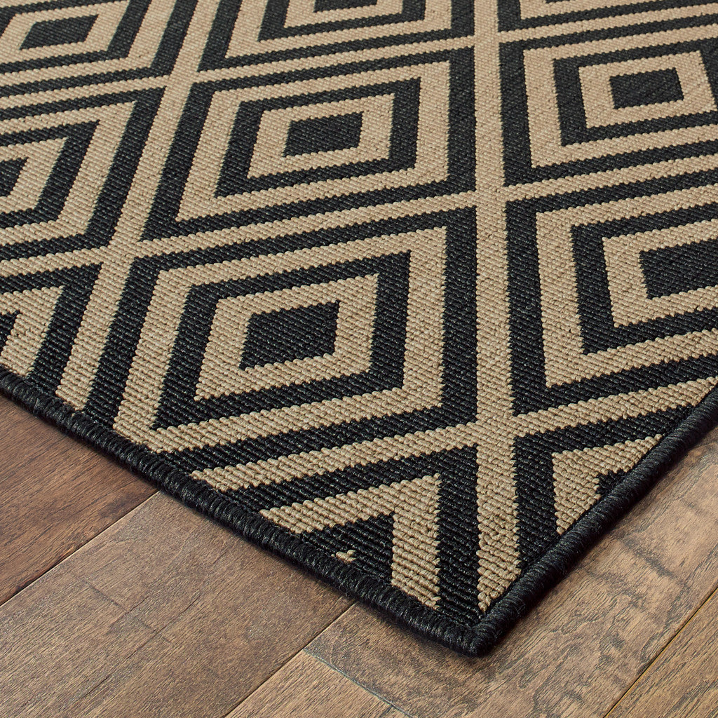 5' x 8' Black and Tan Geometric Stain Resistant Indoor Outdoor Area Rug