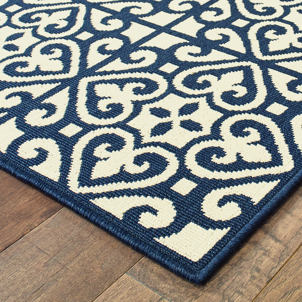 2' X 4' Ivory and Blue Geometric Stain Resistant Indoor Outdoor Area Rug