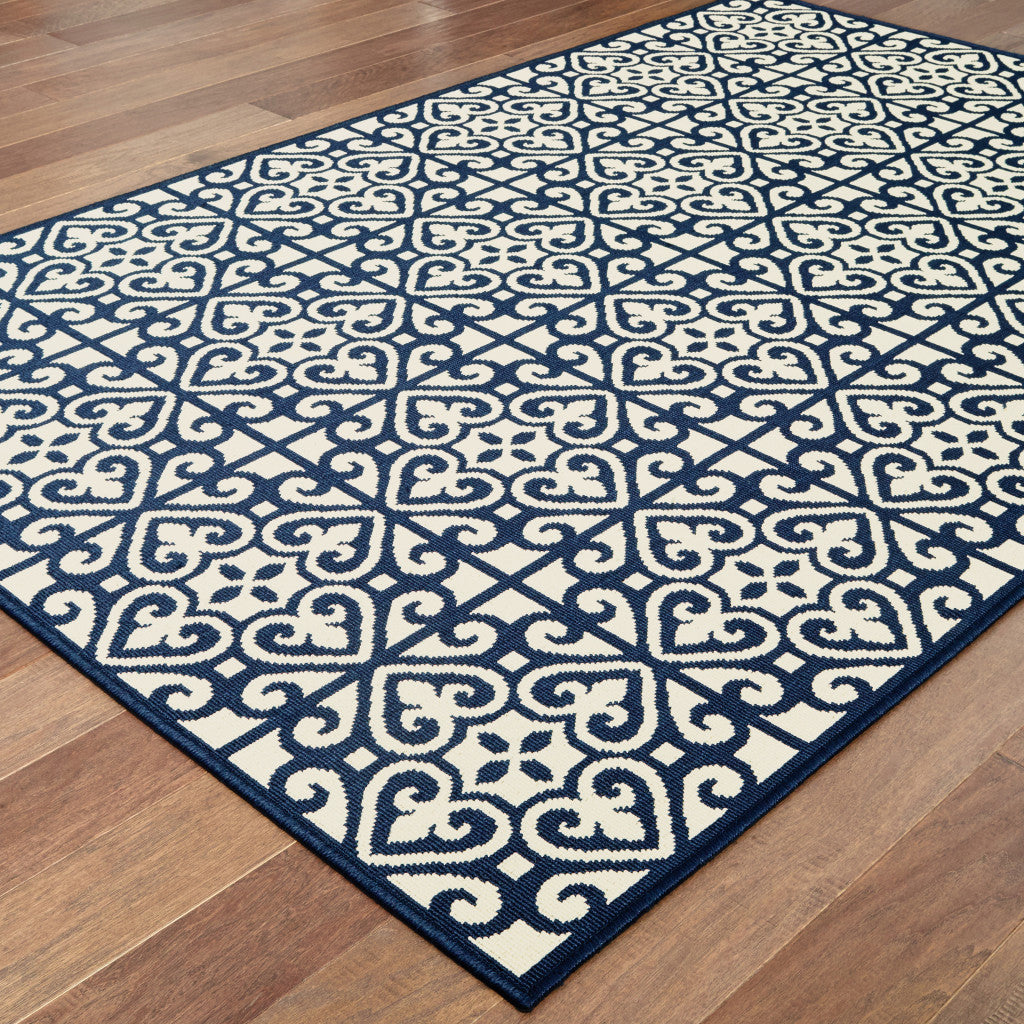 4' x 6' Ivory and Blue Geometric Stain Resistant Indoor Outdoor Area Rug