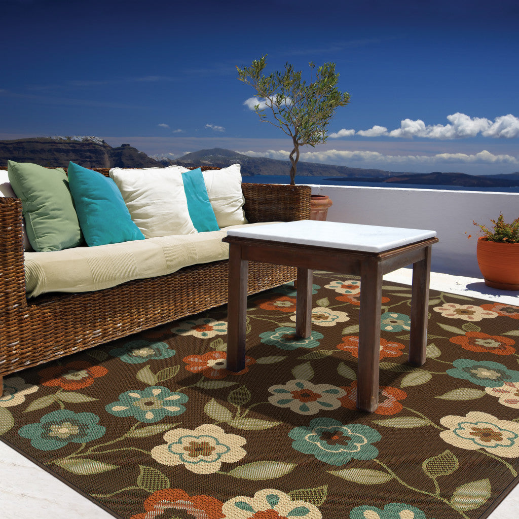 7' x 10' Brown and Ivory Floral Stain Resistant Indoor Outdoor Area Rug