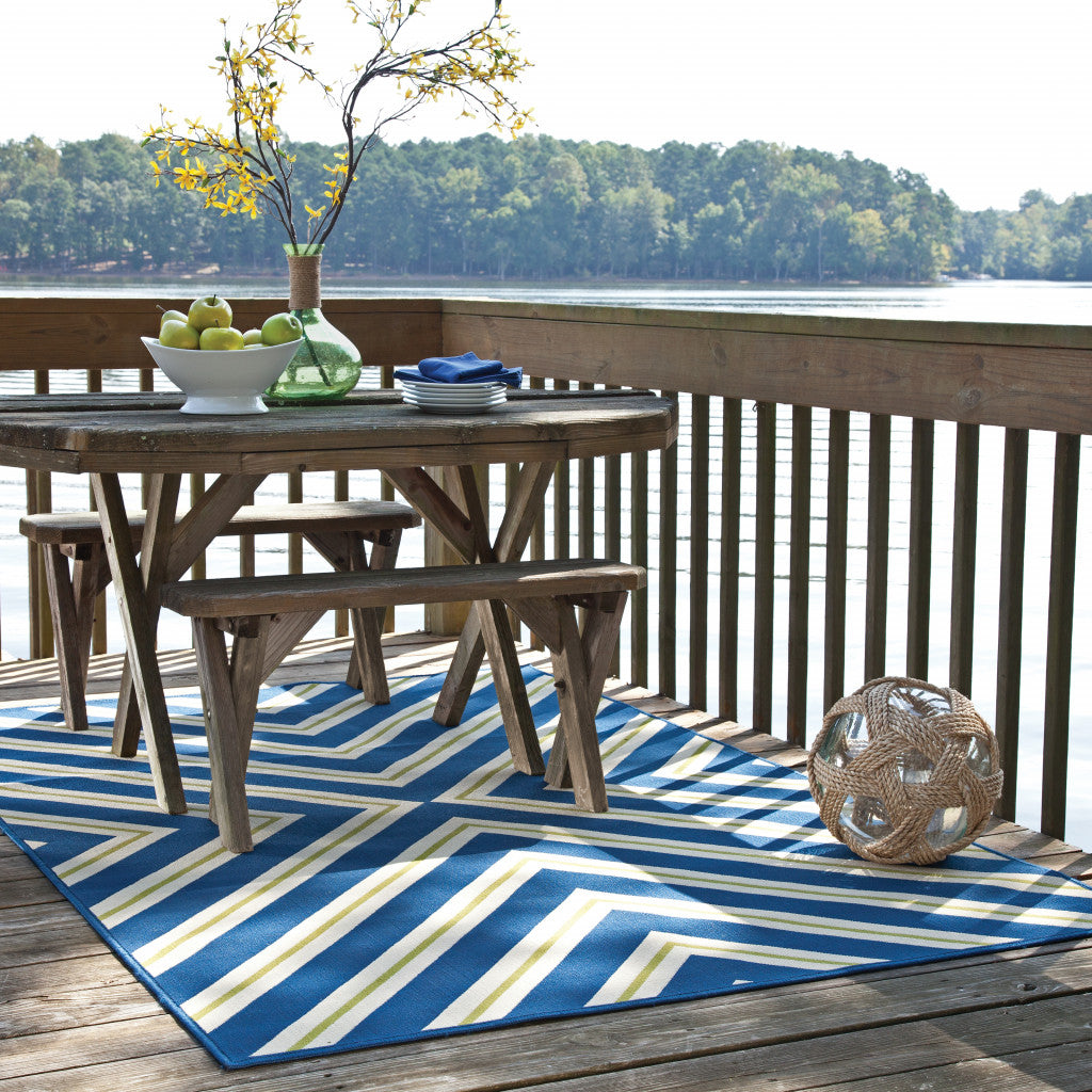 2' X 4' Blue and Ivory Geometric Stain Resistant Indoor Outdoor Area Rug