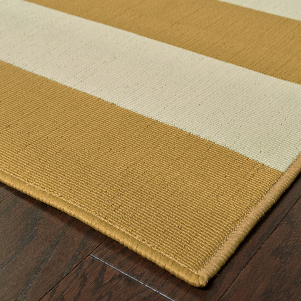 2' X 4' Gold and Ivory Geometric Stain Resistant Indoor Outdoor Area Rug