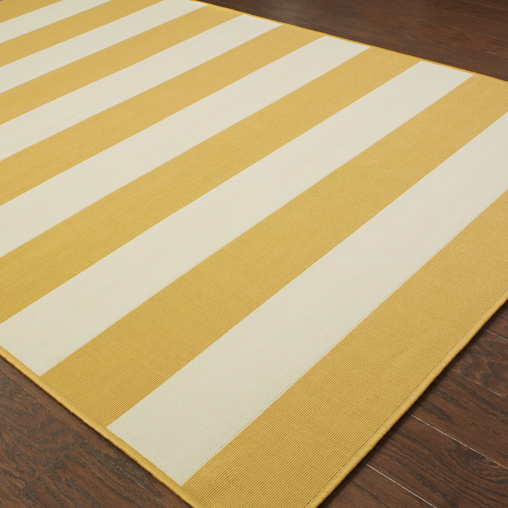 2' X 4' Gold and Ivory Geometric Stain Resistant Indoor Outdoor Area Rug