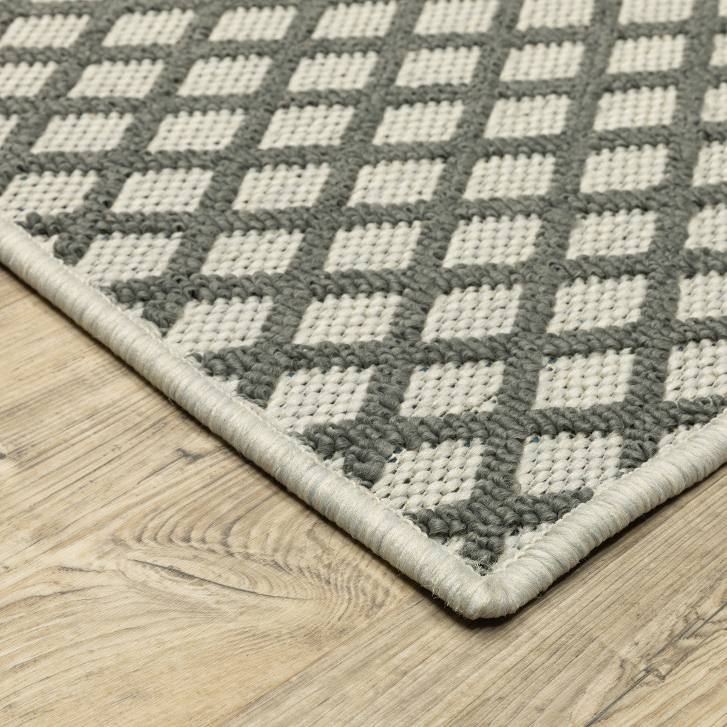 5' x 7' Beige Geometric Stain Resistant Indoor Outdoor Area Rug