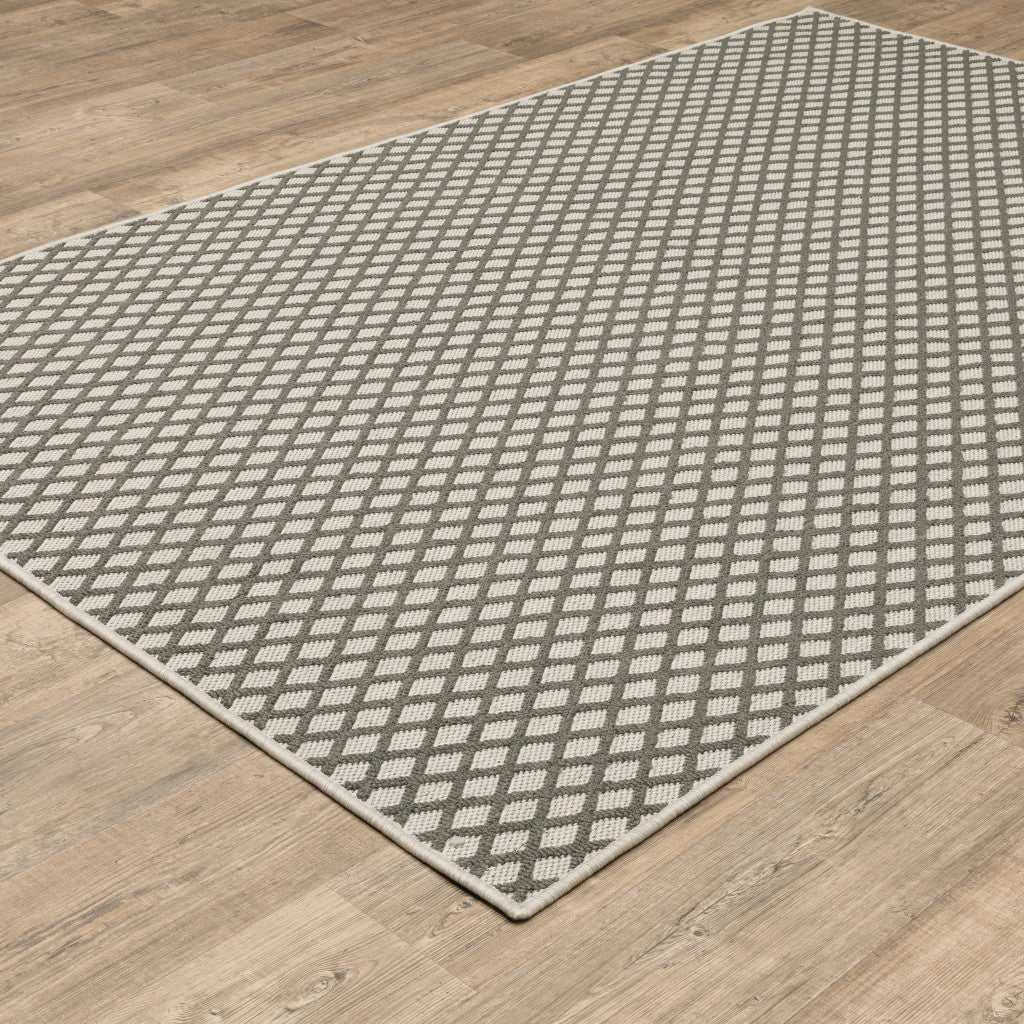 5' x 7' Beige Geometric Stain Resistant Indoor Outdoor Area Rug