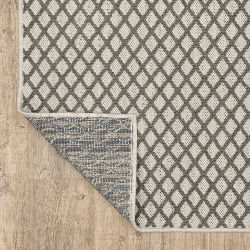 5' x 7' Beige Geometric Stain Resistant Indoor Outdoor Area Rug