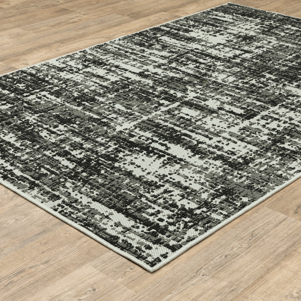 5' x 7' Beige and Black Abstract Stain Resistant Indoor Outdoor Area Rug