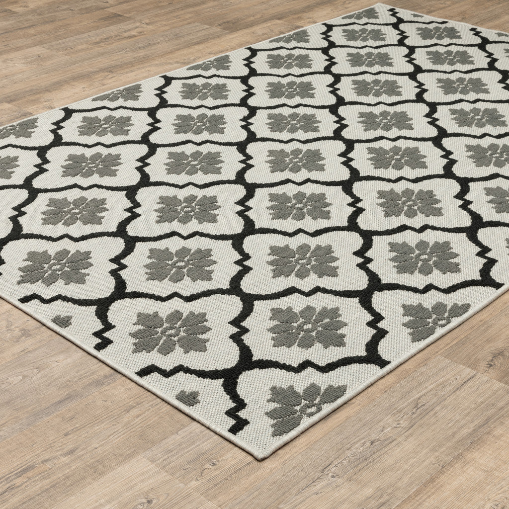 7' x 9' Beige and Black Geometric Stain Resistant Indoor Outdoor Area Rug