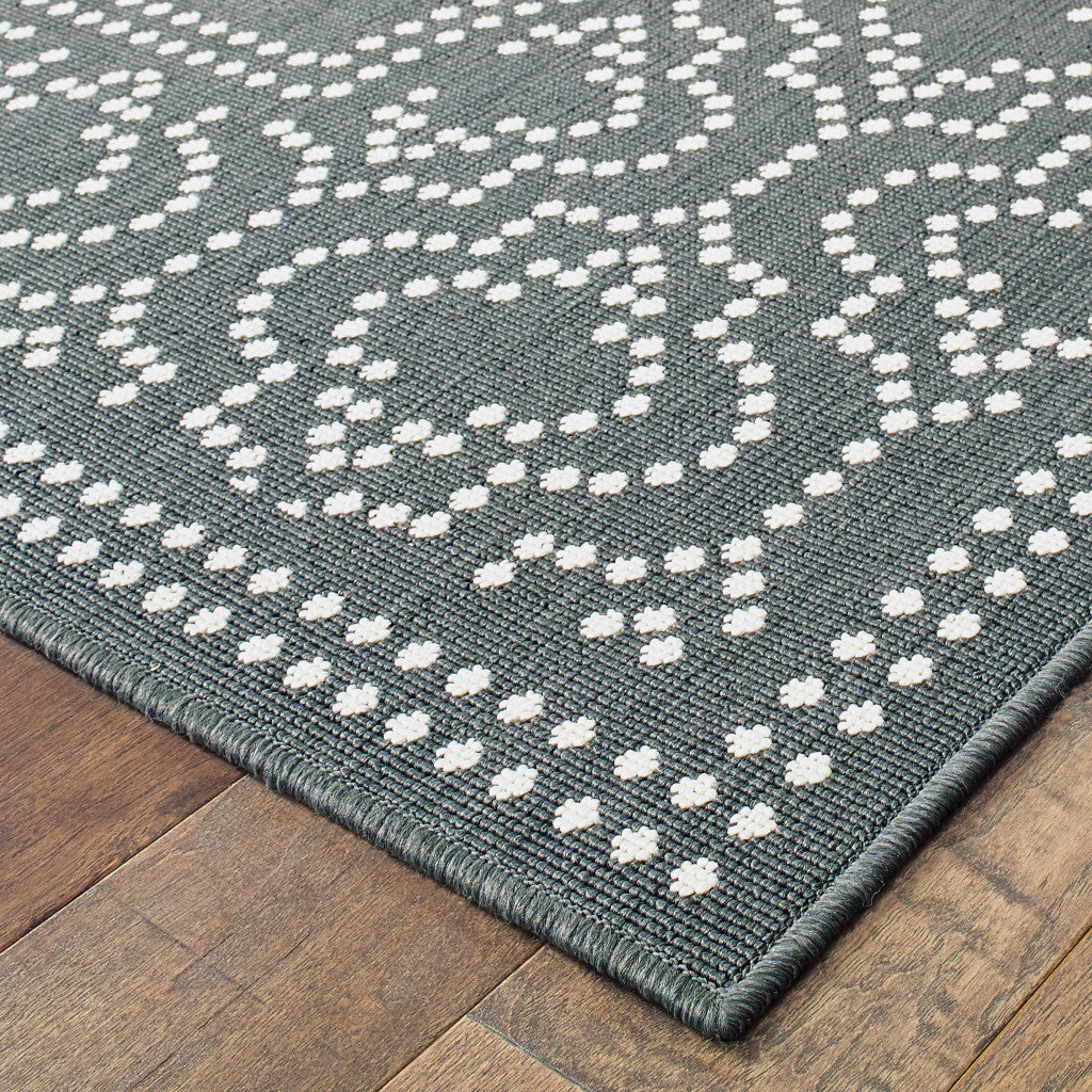 5' x 8' Gray and Ivory Stain Resistant Indoor Outdoor Area Rug