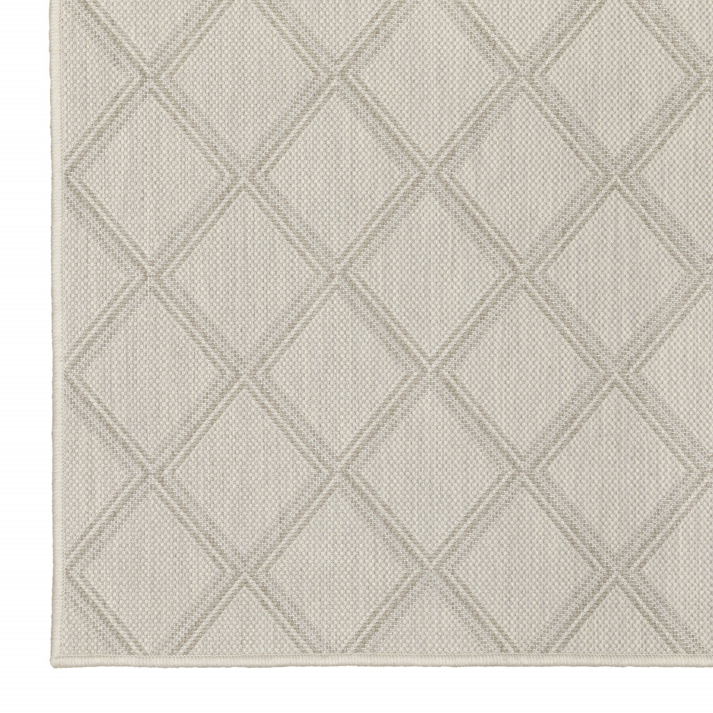 7' x 9' Gray and Ivory Geometric Stain Resistant Indoor Outdoor Area Rug