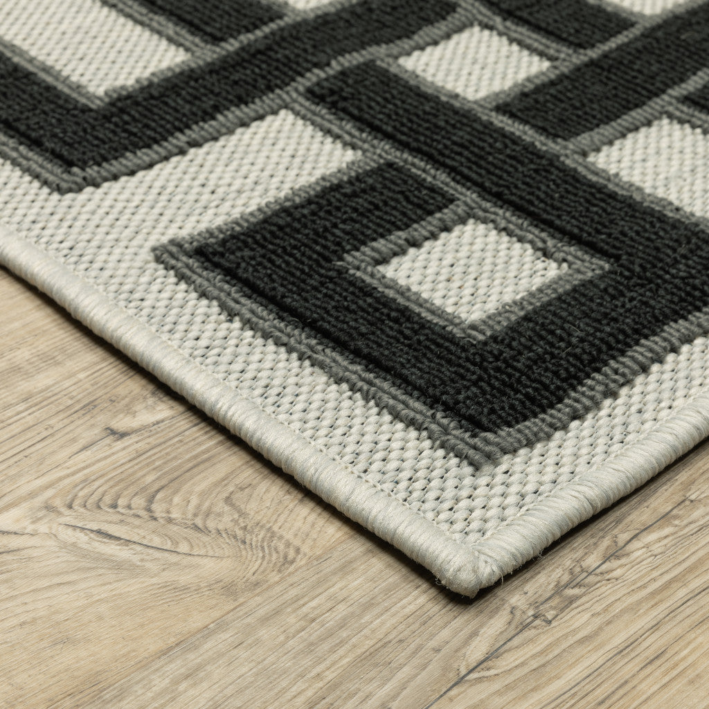 2' X 7' Beige and Black Stain Resistant Indoor Outdoor Area Rug