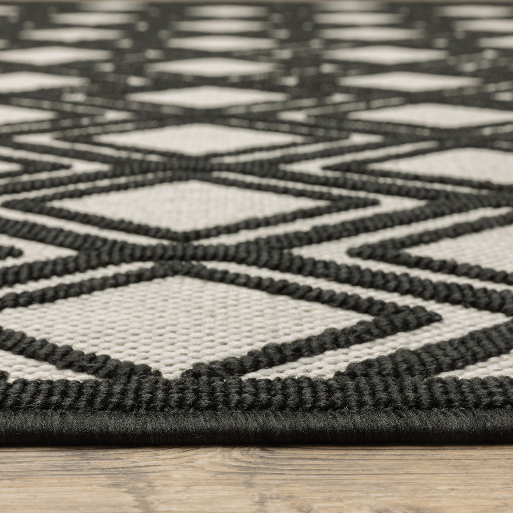 2' X 4' Beige and Black Geometric Stain Resistant Indoor Outdoor Area Rug