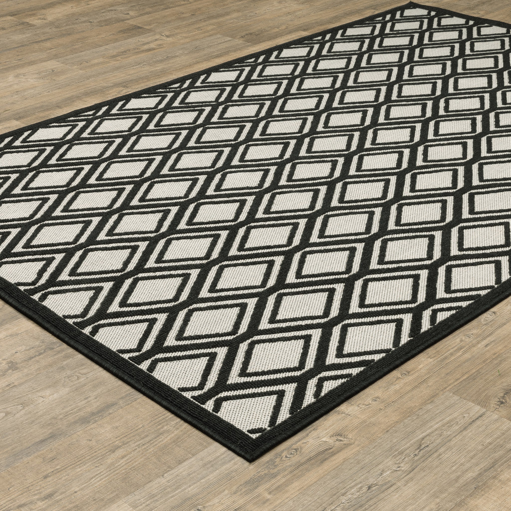 2' X 4' Beige and Black Geometric Stain Resistant Indoor Outdoor Area Rug