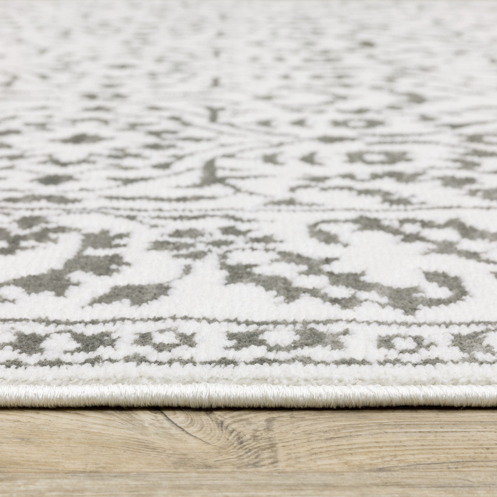 10' X 13' Grey And White Floral Power Loom Stain Resistant Area Rug