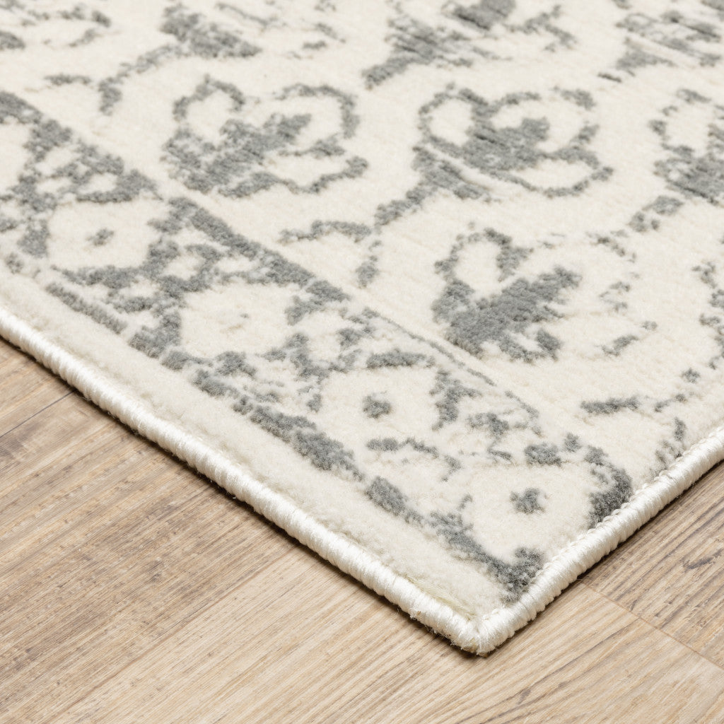 10' X 13' Ivory And Grey Floral Power Loom Stain Resistant Area Rug