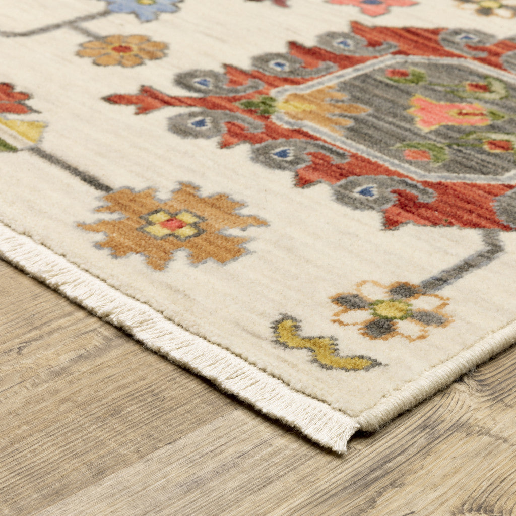 10' X 13' Ivory Yellow Rust Green Grey Pink Orange Blue And Grey Oriental Power Loom Stain Resistant Area Rug With Fringe