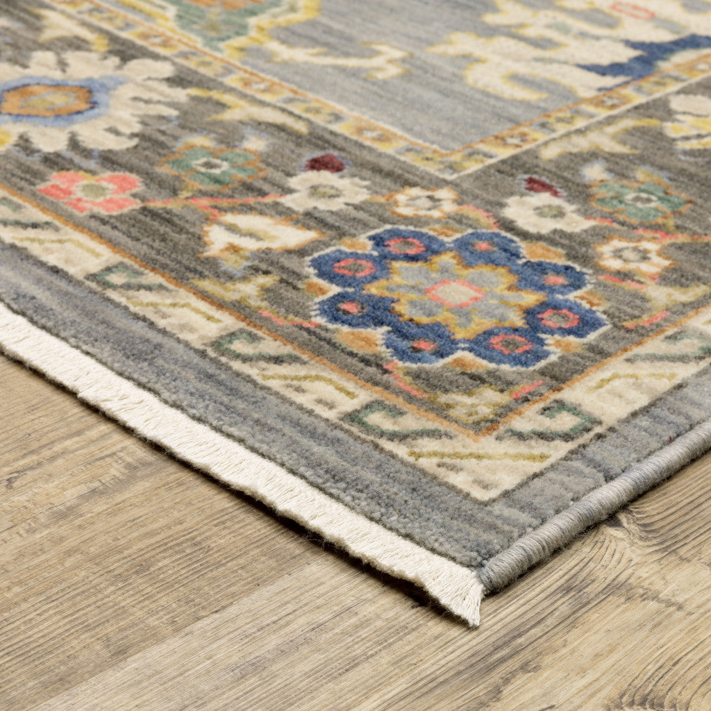 10' X 13' Blue Grey Gold Green Pink Orange Ivory And Red Oriental Power Loom Stain Resistant Area Rug With Fringe