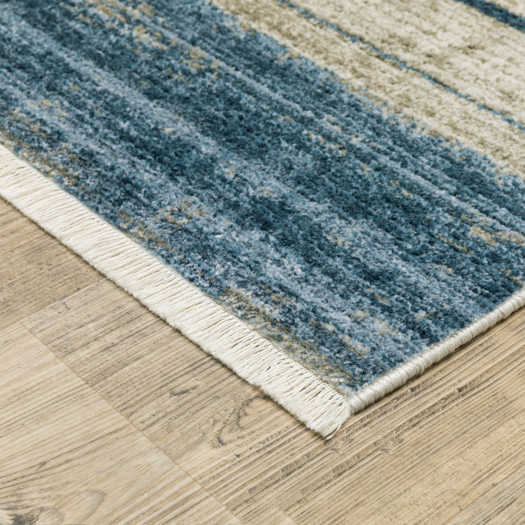 10' X 13' Blue Dark Blue Teal Grey Ivory Beige And Tan Geometric Power Loom Stain Resistant Area Rug With Fringe