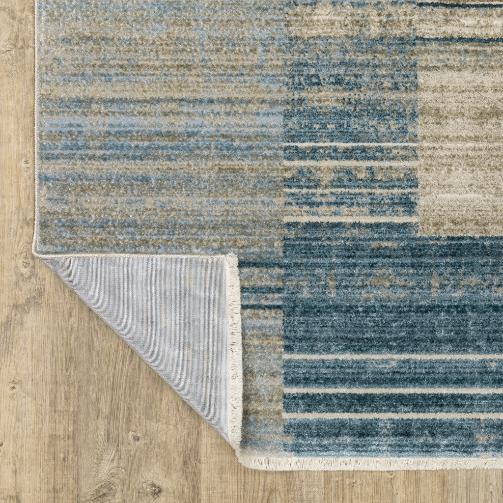 10' X 13' Blue Dark Blue Teal Grey Ivory Beige And Tan Geometric Power Loom Stain Resistant Area Rug With Fringe