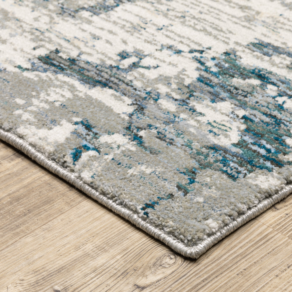 10' X 13' Blue Beige And Teal Abstract Power Loom Stain Resistant Area Rug