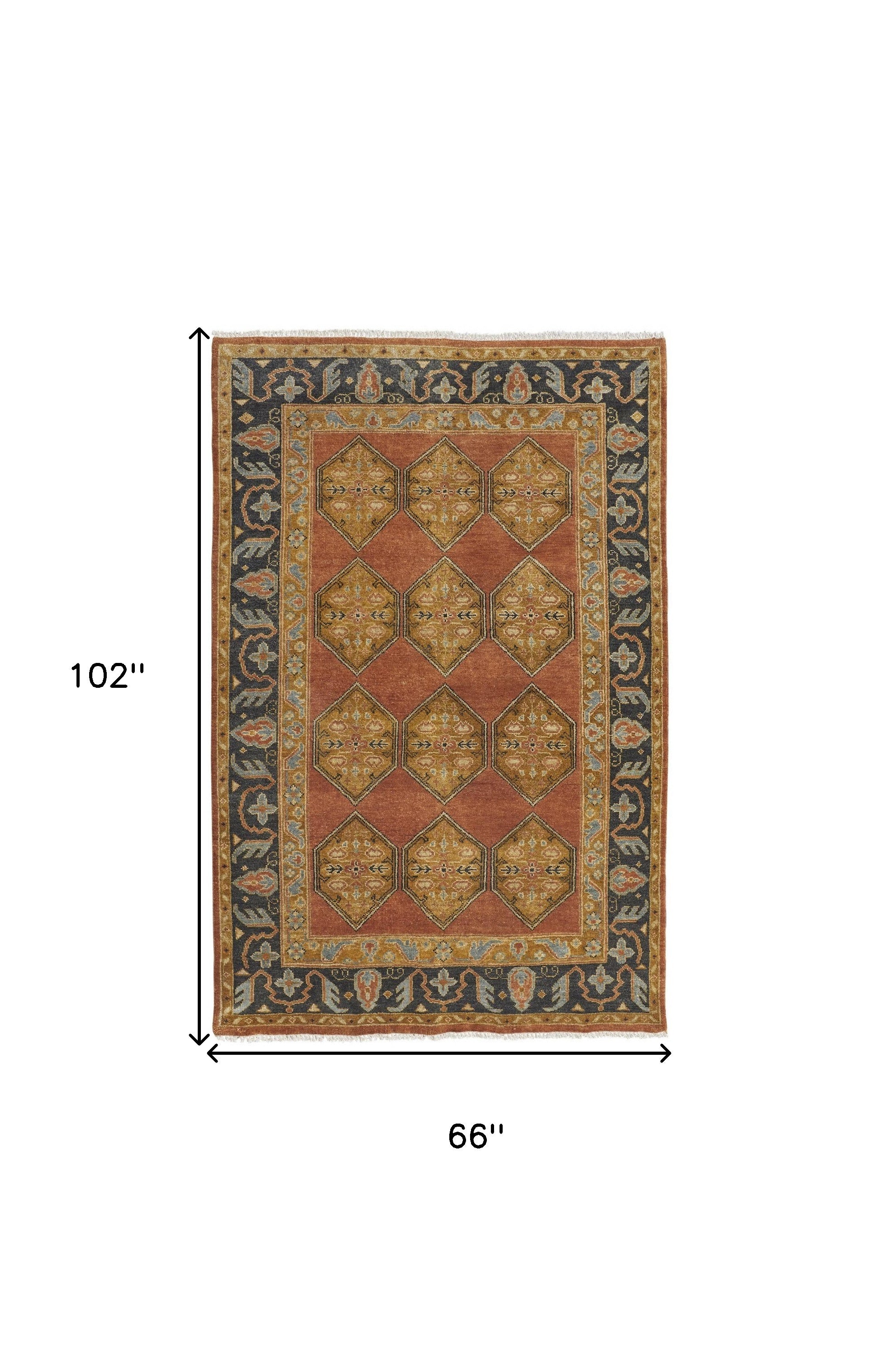 5' X 8' Tan Orange And Brown Wool Floral Hand Knotted Stain Resistant Area Rug