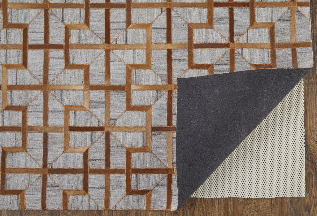 5' X 8' Tan Brown And Gray Geometric Hand Woven Area Rug