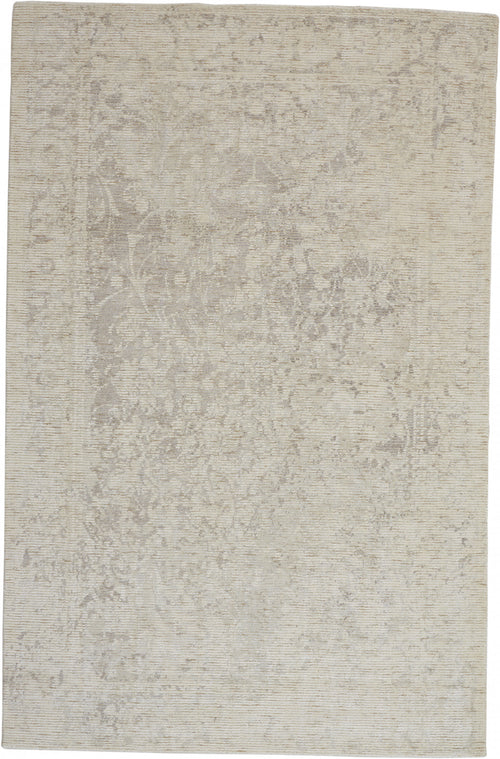 8' X 11' Ivory And Tan Abstract Hand Woven Area Rug