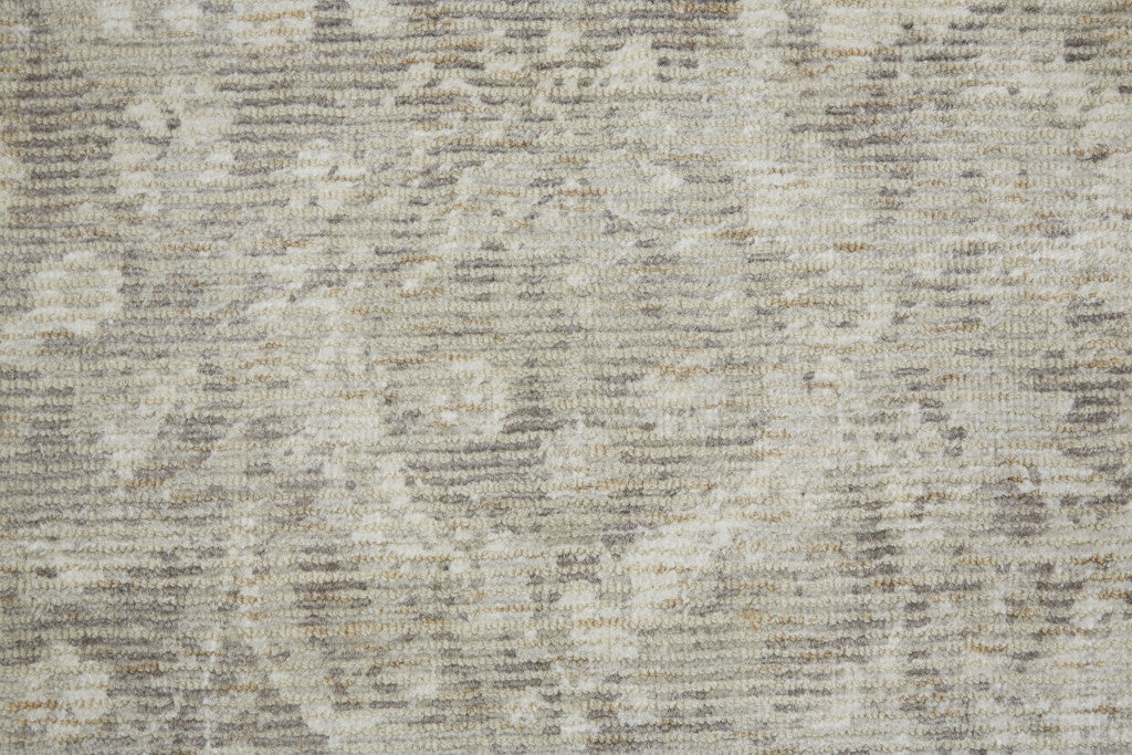 8' X 11' Ivory And Tan Abstract Hand Woven Area Rug