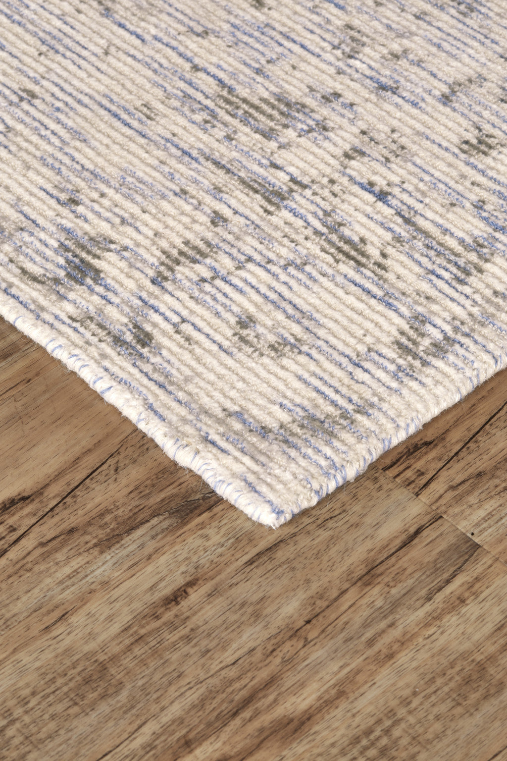 5' X 8' Ivory Blue And Tan Abstract Hand Woven Area Rug