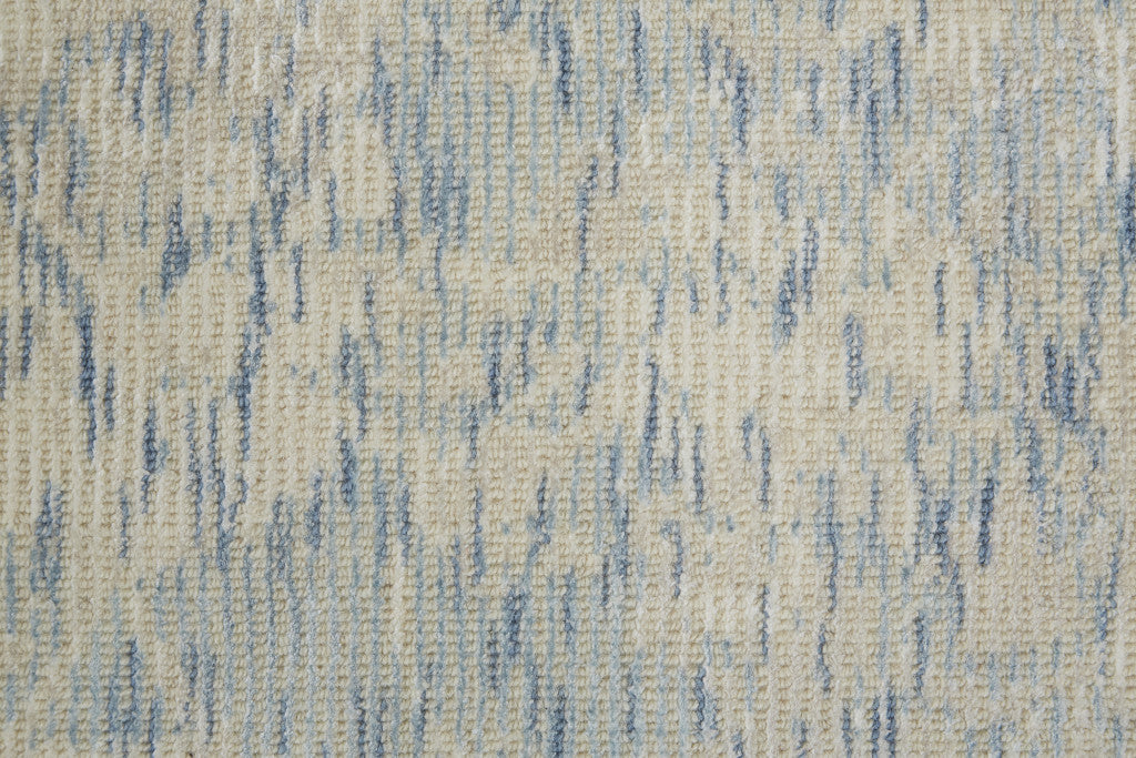 5' X 8' Ivory Blue And Tan Abstract Hand Woven Area Rug